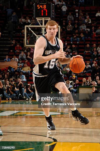 Matt Bonner of the San Antonio Spurs drives against the Seattle Sonics during the game at Key Arena on November 26, 2006 in Seattle, Washington. The...