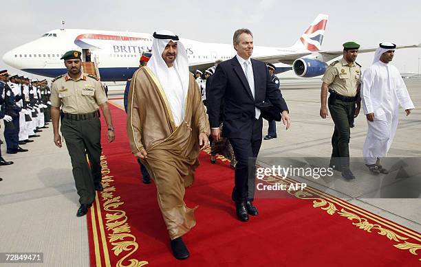 Abu Dhabi, UNITED ARAB EMIRATES: Britain's Prime Minister Tony Blair is welcomed by United Arab Emirates' Crown Prince Sheikh Mohammed Bin Zayed Al...