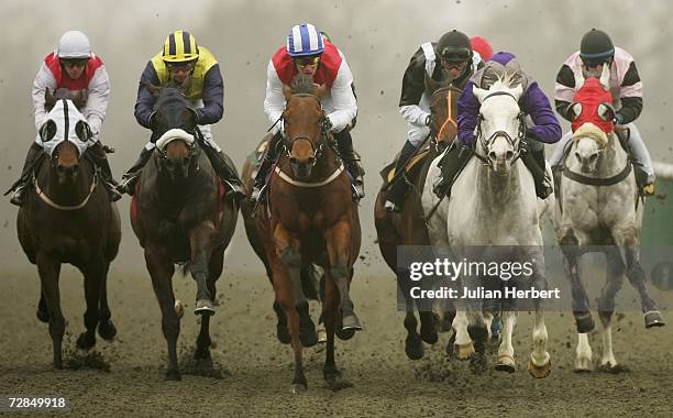 Richard Hughes and Super Frank come down the back straight to land Division One of The Pontins Familly Holidays Handicap Stakes Race run at Lingfield...