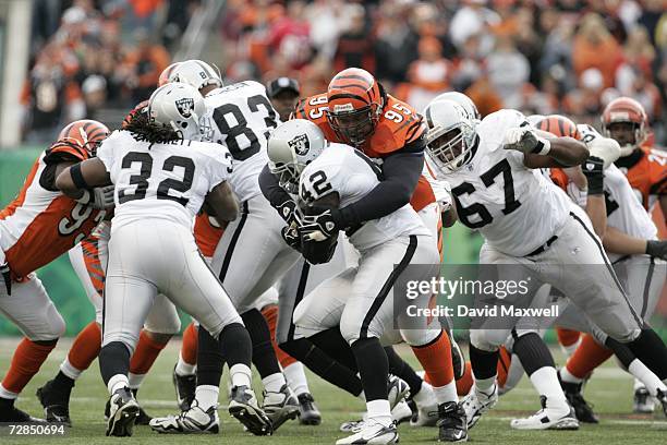 Defensive tackle Sam Adams of the Cincinnati Bengals tackles running back ReShard Lee of the Oakland Raiders on December 10, 2006 at Paul Brown...