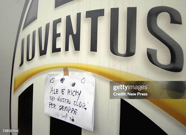 Message of condolence is affixed to the Juventus shield after two youth players, Alessio Ferramosca and Riccardo Neri, drowned after falling into a...