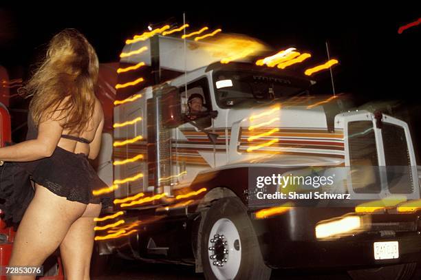 Gabbi works the night shift near the coca cola factory on the Pan American road on February 1, 2002. In the last few years, an all-transvestite...