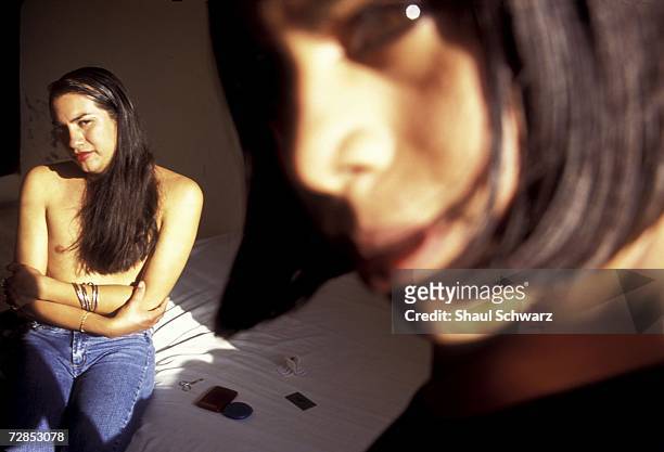 Marcella and Raul in a local hotel room in Juchitan, Mexico, October 1, 2002. In the sleeepy southern Mexican fishing town of Juchitan of roughly...