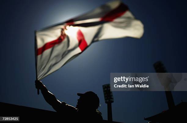 An England fan waves a flag duning the third Ashes test December 14 in Perth, Australia. The Ashes are the most coveted prize in world test cricket,...