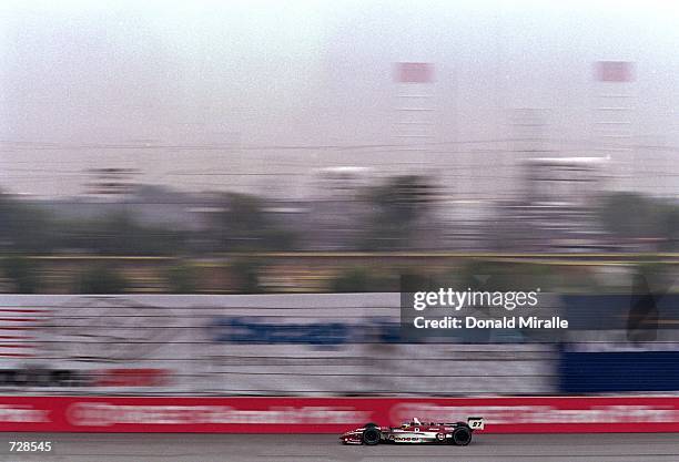 Driver Cristiano de Matta of Brazil who drives a Toyota Reynard 2KI for PPI Motorsports speeds down the track during the Target Grand Prix of...