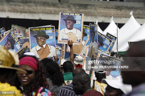 Supporters dance with posters of Nigerian Vice President Atiku Abubakar 20 December 2006 in Tafawa Balewa Square in Lagos, where the politician came...