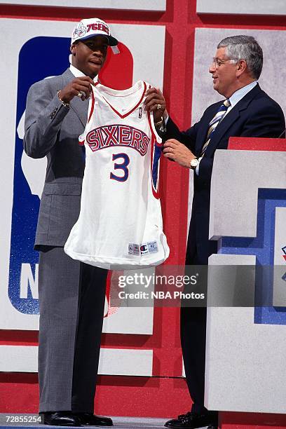 Allen Iverson holds up a76ers uniform with NBA Commissioner David Stern after being drafted by the Philadelphia 76ers in the first round of the 1996...