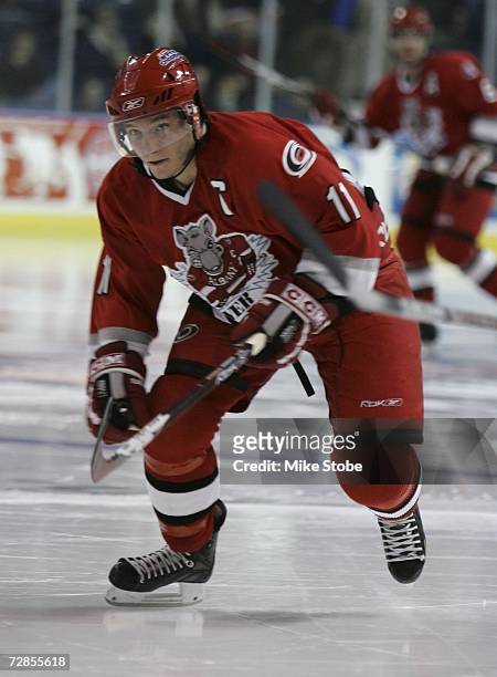 Keith Aucoin of the Albany River Rats skates against the Bridgeport Sound Tigers at the Arena at Harbor Yard on November 26, 2006 in Bridgeport,...