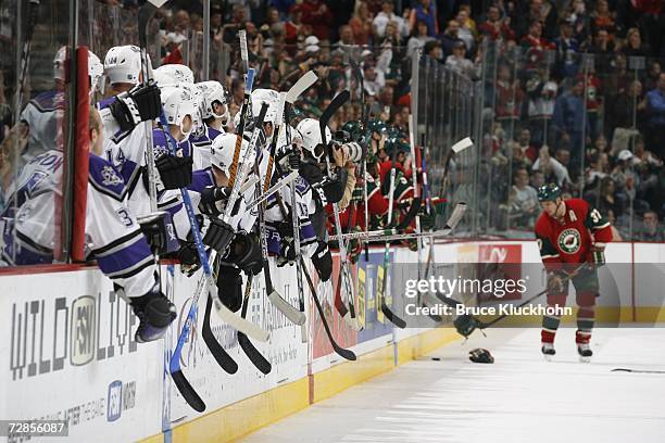 Players from the Minnesota Wild and the Los Angeles Kings bang on the boards with their sticks during a game at Xcel Energy Center on October 25,...