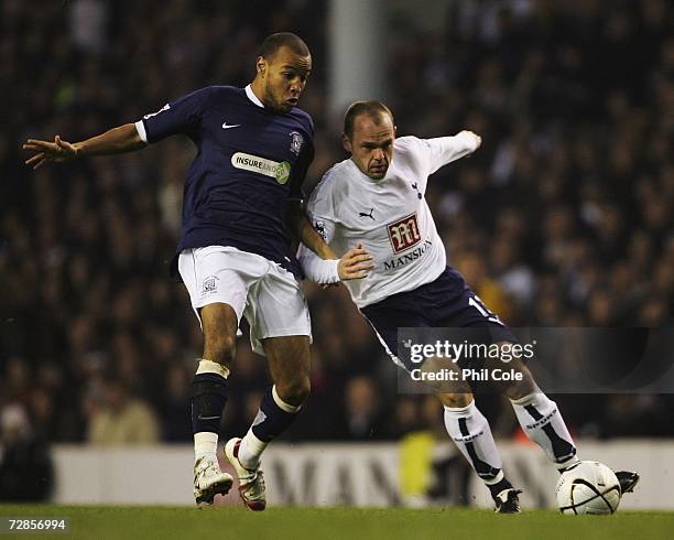 Lewis Hunt of Southend United battles with Danny Murphy of Tottenham Hotspur during the Carling Cup Quarter Final match between Tottenham Hotspur and...