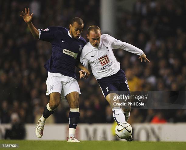 Lewis Hunt of Southend United battles with Danny Murphy of Tottenham Hotspur during the Carling Cup Quarter Final match between Tottenham Hotspur and...