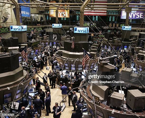 Traders work on the floor of the New York Stock Exchange December 20, 2006 in New York City. The NYSE Group Inc. Approved the $14.6 billion purchase...