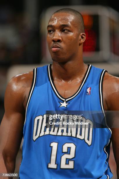 Dwight Howard of the Orlando Magic looks on against the Sacramento Kings on December 4, 2006 at ARCO Arena in Sacramento, California. NOTE TO USER:...