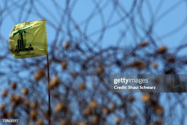 Hezbollah flag still stands just meters into Lebanon July 21, 2006. Israeli soldiers started crossing the border today in higher numbers than in past...