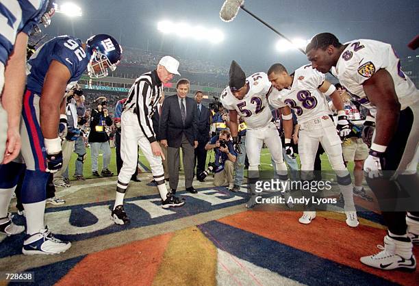 View of the coin toss taken before Super Bowl XXXV between the New York Giants and the Baltimore Ravens at the Raymond James Stadium in Tampa,...