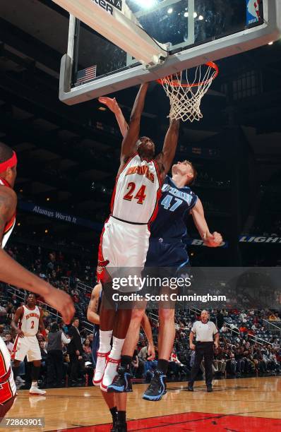 Marvin Williams of the Atlanta Hawks puts up a shot against Andrei Kirilenko of the Utah Jazz at Philips Arena on December 20, 2006 in Atlanta,...