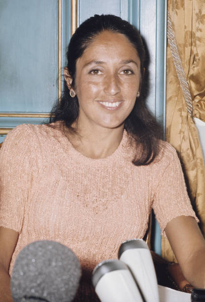American folk singer and musician Joan Baez pictured attending a press conference in Paris, France following her performance on French television...