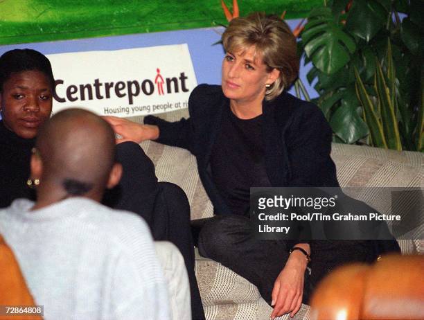 Princess Diana as Patron of Centrepoint charity for homeless people talks with a young homeless person at a Centrepoint homeless hostel during her...
