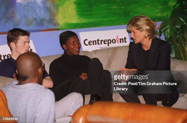 Princess Diana as Patron of Centrepoint charity for homeless people talks with young homeless people at a Centrepoint homeless hostel during her...