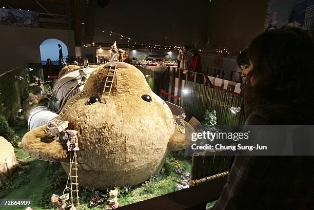 People look at a display during a "Teddy and Friends Around the World in a Day" exhibition on December 21, 2006 in Seoul, South Korea. Along with the...