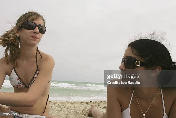 Rachel Hayes and Gaby Harari relax on the beach December 21, 2006 in Miami Beach, Florida. A study by the Harvard School of Public Health links...