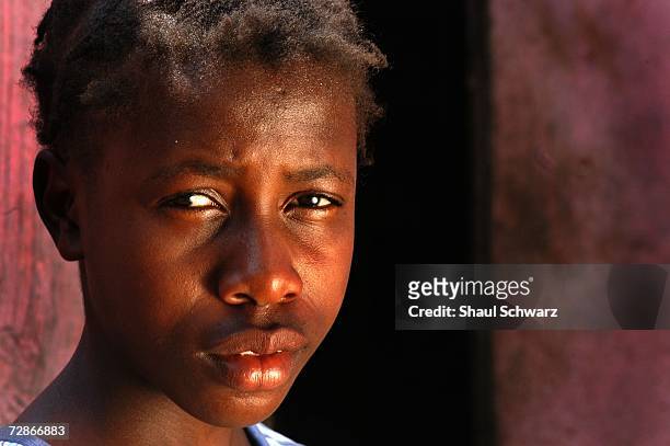 Tablita, a 14-year-old "restavek", poses for a portrait outside her "host" family's home, on March 30, 2005 in Port-au-Prince, Haiti. Tablita worries...