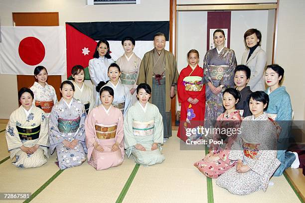 Queen Rania of Jordan and daughter Princess Iman pose with Japan's First Lady Akie Abe , students and teachers at the Sodo Kimono Academy on December...