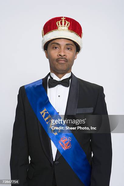 mature man wearing king's crown and sash, portrait - sash stock pictures, royalty-free photos & images