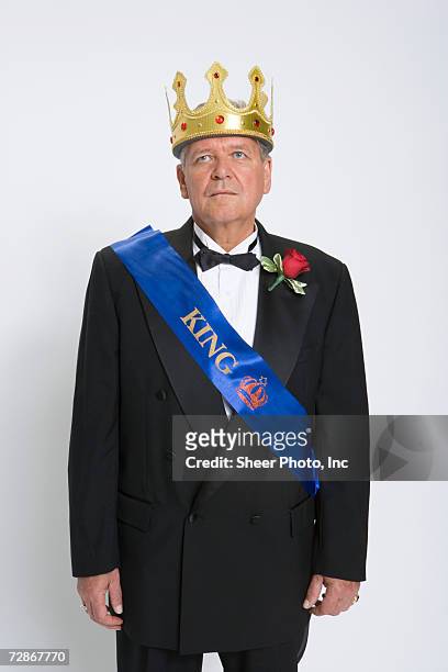 mature man wearing king's crown and sash, looking up - sash stock pictures, royalty-free photos & images