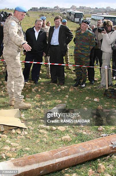 Belgian UNIFIL soldier shows a minfield to Belgium's Prime Minister Guy Verhofstadt and Defense Minister Andre Flahaut during their visit to the...