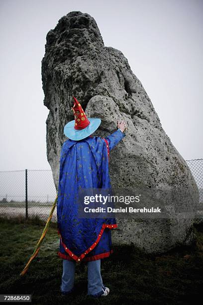 Solstice participant recites incantations at the Stonehenge heel stone on December 22, 2006 in Salisbury, England. Hundreds of people attended the...