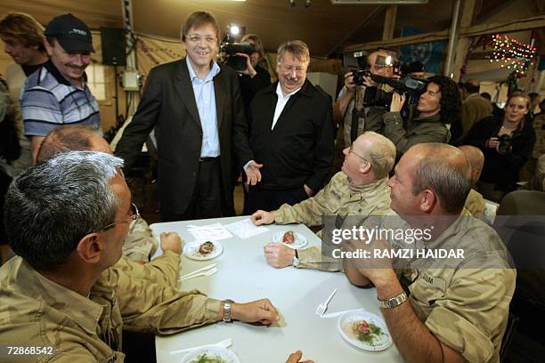Belgium's Prime Minister Guy Verhofstadt and Defense Minister Andre Flahaut arrive for lunch with Belgian troops of the UN Interim force in Lebanon...