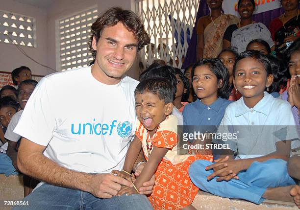 Swiss tennis player and UNICEF Goodwill Ambassador Roger Federer interacts with children at a shelter for people affected by the December 2004...