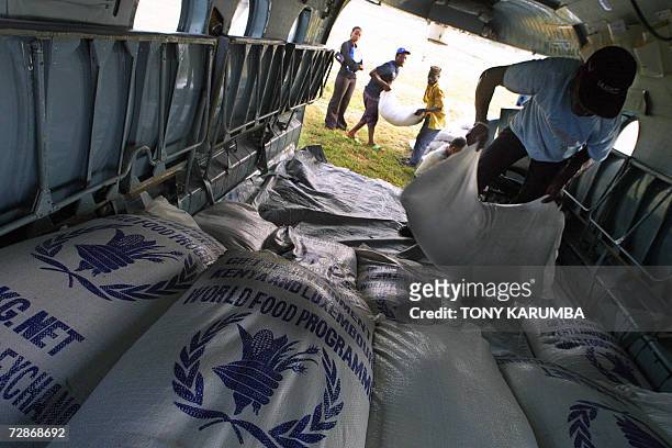 Villagers pack relief supplies into a helicopter at Malindi December 2006 to be flown to drought ravaged Gaarsen in Tana River district where atleast...