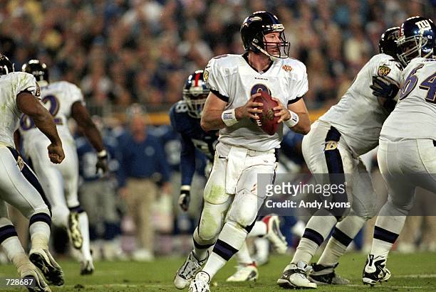 Trent Dilfer of the Baltimore Ravens drops back to pass the ball during the Super Bowl XXXV Game against the New York Giants at the Raymond James...