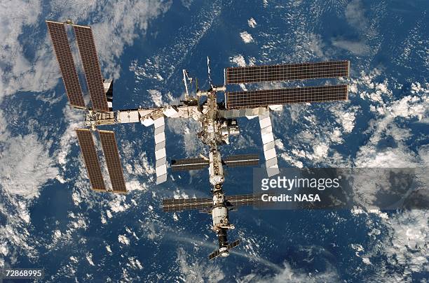 In this handout from NASA, the International Space Station is seen from the Space Shuttle Discovery after undocking from the station December 19,...
