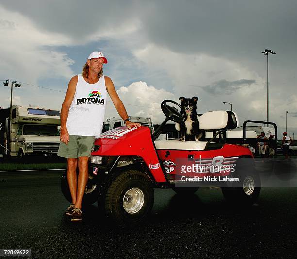 Gary Beach of Riverview, Florida and his dog Jesse-Girl pose in front of his customized ATV, decorated in full Dale Earnhardt Jr. #8 red-colored...
