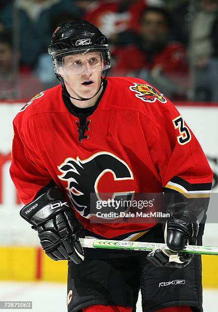 Dion Phaneuf of the Calgary Flames skates against the Minnesota Wild during their NHL game at Pengrowth Saddledome in Calgary, Alberta, Canada. The...