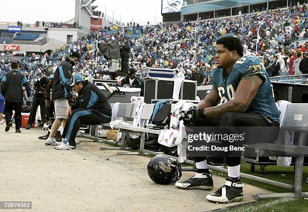 Offensive lineman Khalif Barnes of the Jacksonville Jaguars sits on the end of the bench after losing to the New England Patriots on December 24,...