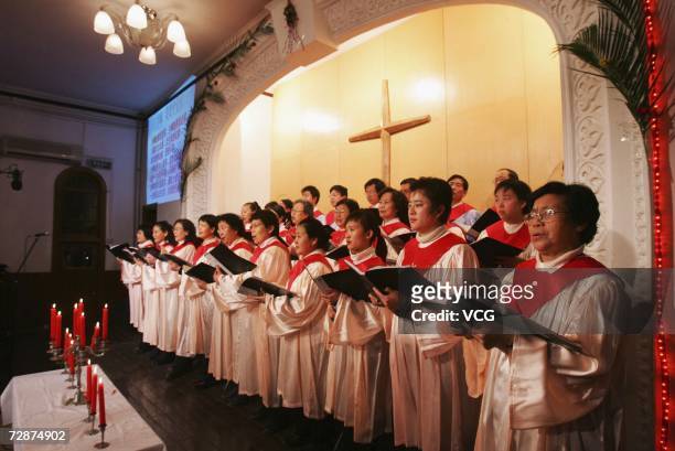 Christian choir sings as church-goers attend a service on Christmas Eve, on December 24 in Beijing, China. Christmas Day is not a public holiday in...