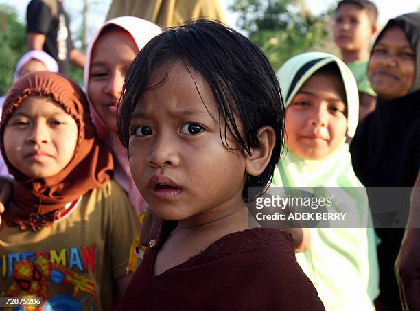 Acehnese children and women flee from their homes at Arakudo subdistrict in Langsa, East Aceh, 25 December 2006. Two years after the devastating...