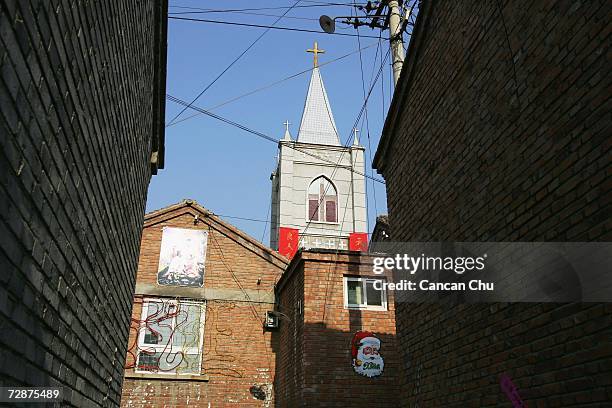 The state-sanctioned ShangYu Church is seen behind the residential houses at the ShangYu village before the Christmas mass on December 24, 2006 on...