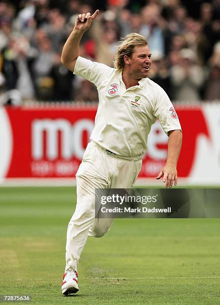 Shane Warne of Australia celebrates taking his 700th wicket during day one of the fourth Ashes Test Match between Australia and England at the...