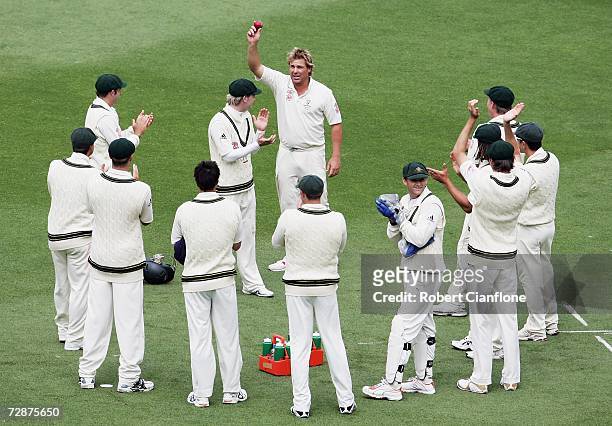 Shane Warne of Australia celebrates his 700th test wicket after he bowled Andrew Strauss of England during day one of the fourth Ashes Test Match...