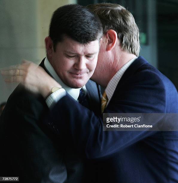 James Packer is hugged by federal treasurer Peter Costello, after announcing a foundation to be set up in his father?s name to assist Australian...