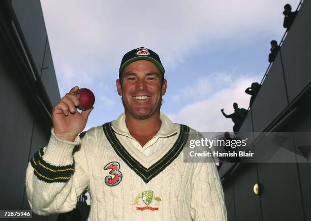 Shane Warne of Australia holds the ball he took his 700th career wicket with after day one of the fourth Ashes Test Match between Australia and...