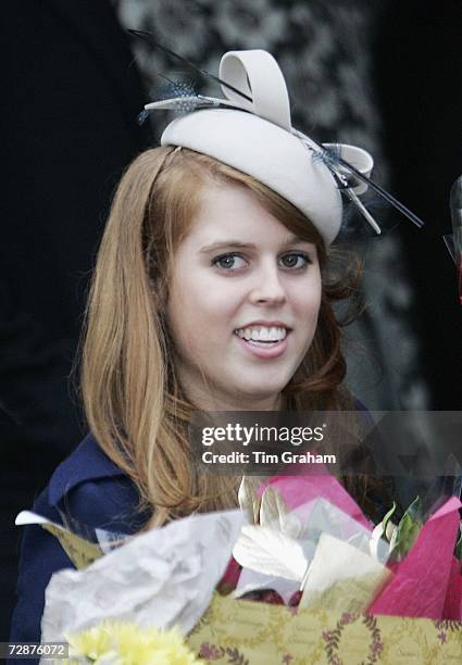 Princess Beatrice holding flowers for her grandmother the Queen after Christmas Day service at Sandringham Church on December 25, 2006 in Kings's...