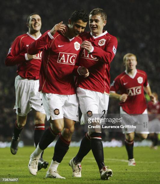 Cristiano Ronaldo of Manchester United is congratulated by team mate Ole Gunnar Solskjaer after scoring his team's second goal during the Barclays...