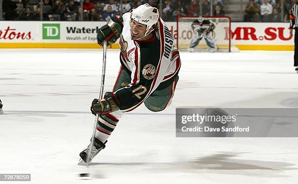 Brian Rolston of the Minnesota Wild takes a shot against the Toronto Maple Leafs during their NHL game at the Air Canada Centre December 26, 2006 in...