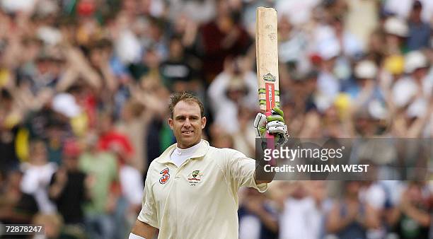 Australian batsman Matthew Hayden celebrates scoring his century against England on the second day of the fourth cricket Test at the MCG in...